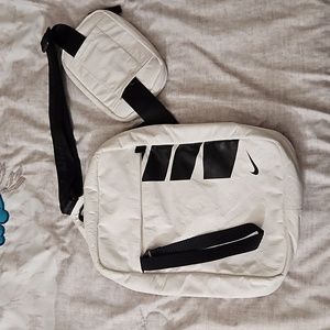 Nike Essentials crossbody sling bag with movable strap and removable pouch